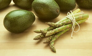 Asparagus and avocados are healthy early spring foods.