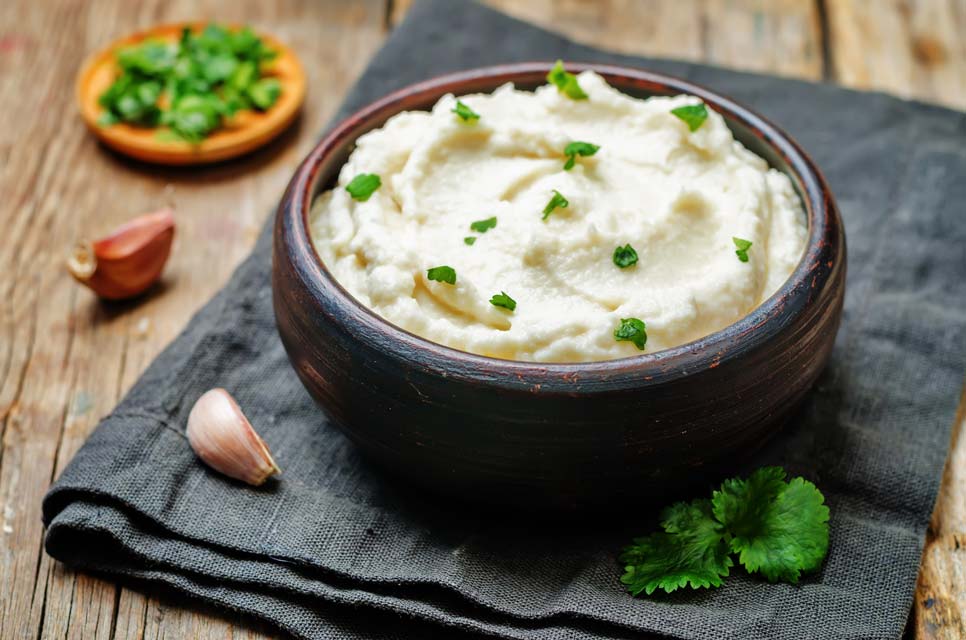 Learn how to make cauliflower mashers with rich goat cheese.