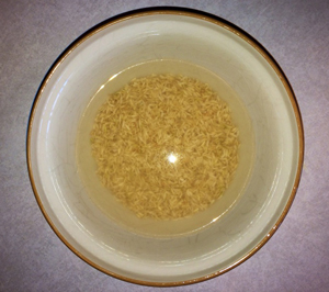 Use a clean glass bowl for sprouting rice. Use twice as much water as rice.